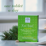 The bright green Ear Tone™ package displayed with a single tablet and text One tablet a day.