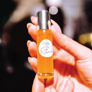 Herbal Schools 40 Hand holding small New Nordic bottle.